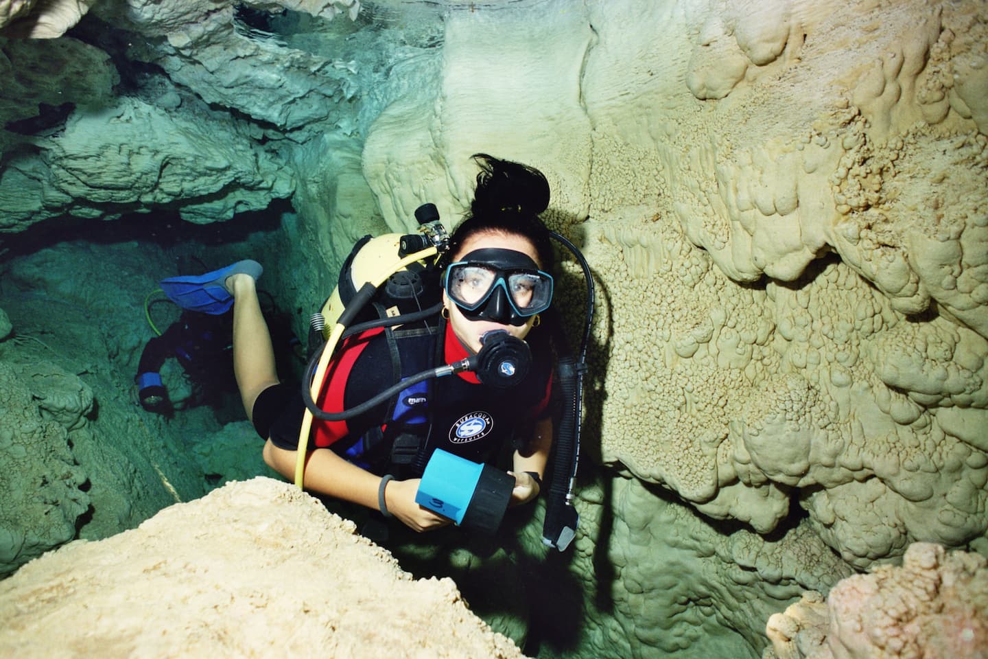 Scuba diver entering an underwater cave in Cuba with Scuba Vida Varadero