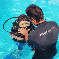 “Instructor demonstrating underwater breathing techniques”