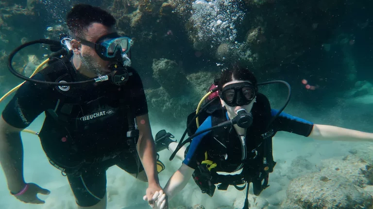 Couple of divers exploring reef coral as part of dicover scuba diving Varadero experience