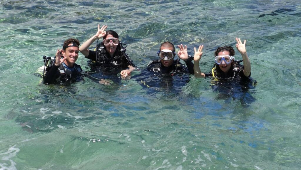Open Water Diver student surfacing after a successful dive