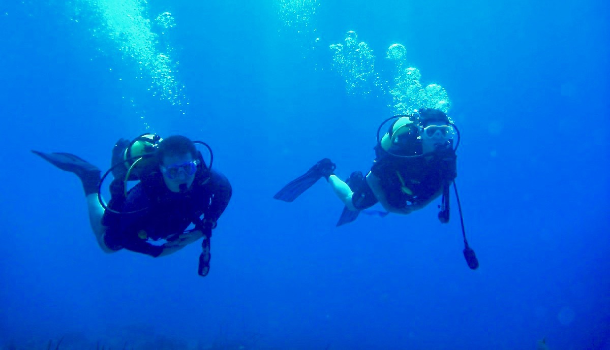 Student hovering underwater during certification training