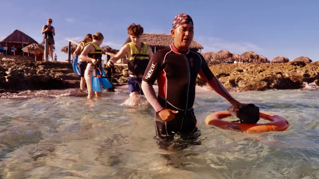 Family snorkeling together in the clear waters of Varadero
