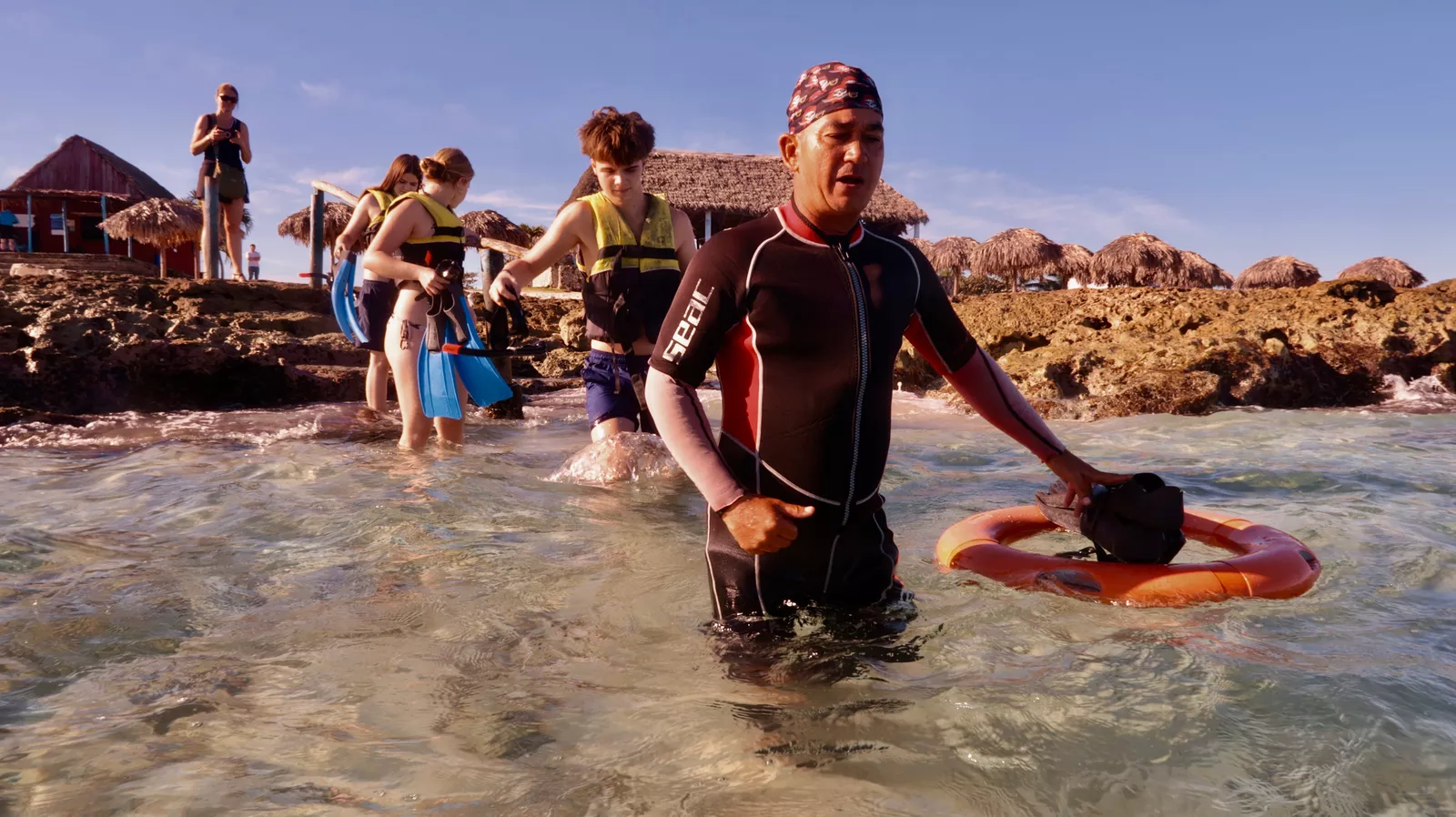 Family snorkeling together in the clear waters of Varadero