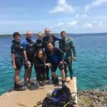 Scuba diving instructors with a family group before a dive in Varadero