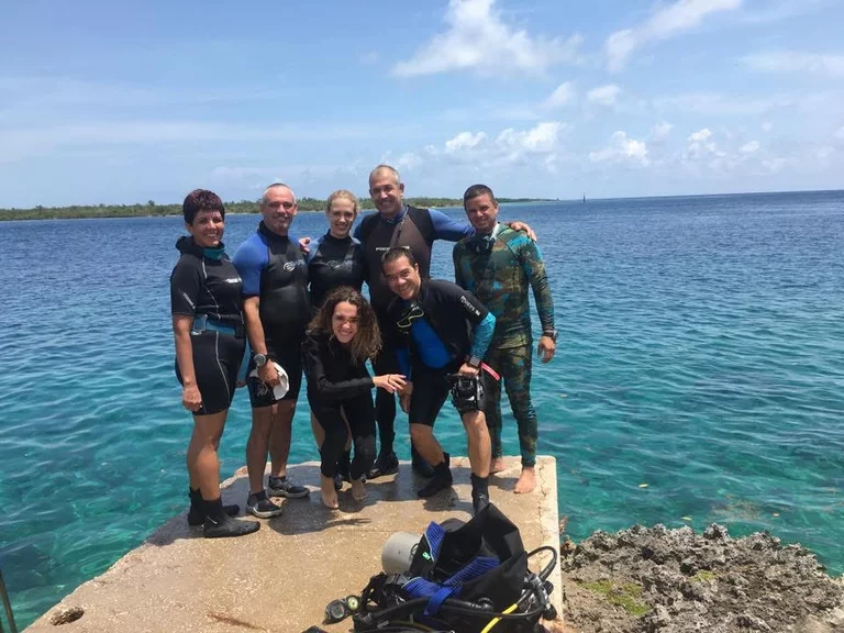 Scuba diving instructors with a family group before a dive in Varadero
