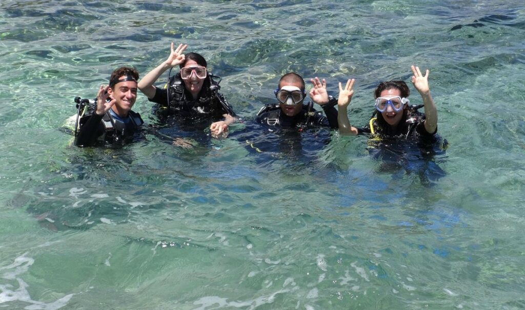 Happy beginner scuba diver with instructor after a first dive in Varadero Cuba