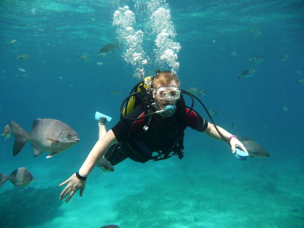 Scuba diver breathing calmly through a regulator underwater