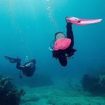 Scuba diver using gentle fin movements above a coral reef in Varadero